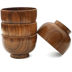 three wooden bowls stacked on top of each other