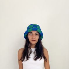 ✮ This checkered bucket hat was designed with the desire to create a funny, young and free street style. ✮ Goes with any outfit and looks great whatever the season. ✮ Like my other products, this checkered bucket hat is also carefully knitted. ✮ Crochet blue and green bucket hat is completely handmade and is 100% cotton.  ✮ Excellent gift checkered bucket hat for men and women. ✮✮ If you want to mix different colors and design a special hat for yourself, you can choose a color from the color scale and let me know. --- Details --- ✮ 100% cotton. ✮ Sun protection, packable. 💐 Care instructions 💐 ✮ Hand washable. ✮ You can iron it with a steam iron.   Note💌 Not sure what hat size you are? No problem it's easy: Just take a measuring tape measure just above your ears around your head; keep t Trendy Green Cotton Hat, Trendy Cotton Bucket Hat For Winter, Trendy Blue Bucket Hat For Winter, Trendy Green Bucket Hat For Spring, Trendy Multicolor Bucket Hat, Trendy Blue Winter Bucket Hat, Trendy Green Crochet Hat, Trendy One-size Hat For Streetwear, Trendy One Size Fits Most Bucket Hat