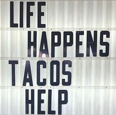 a sign that says life happens tacos help