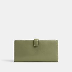 Crafted of refined leather detailed with our Signature hardware the perfectly named Skinny Wallet organizes essentials in a slender silhouette. The snap closure opens to reveal 15 card slots multiple full-length bill compartments a zippered coin pocket and a convenient ID window. | Coach Skinny Wallet - Women's - Brass/moss Green Wallet With Card Slots For Formal Occasions, Classic Wallets With Magnetic Closure For Everyday, Classic Wallet With Magnetic Closure For Everyday, Green Rectangular Wallet For Formal Use, Everyday Bifold Clutch With Magnetic Closure, Green Rectangular Wallet For Formal Occasion, Chic Wallets With Snap Closure For Daily Use, Chic Bifold Wallet For Daily Use, Classic Everyday Wallet With Magnetic Closure