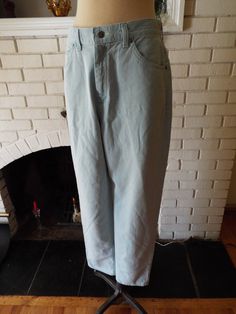 "Here is an awesome pair of blue jeans by Lee Riders. 100% cotton and made in the USA. Wonderful light blue color with white stitching. Two pockets on the front, two on the back, and a cool stitching detail on the back. Lightly worn, super comfy, and in excellent condition with years of life left! The tag says 12 M, but here are the measurements taken laying flat: Waist: 15\" Width of one leg (mid thigh) 9\" Length: 43\"" Light Indigo Cotton Jeans With Five Pockets, Full-length Blue Cotton Jeans, Blue Full-length Cotton Jeans, Blue Cotton Full-length Jeans, Light Wash Cotton Bottoms With Five Pockets, High Rise Light Wash Cotton Jeans, Light Wash Straight Leg Cotton Pants, Light Wash Cotton Straight Leg Pants, Light Indigo Washed Cotton Jeans