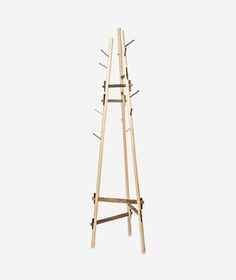 a tall wooden rack with multiple hooks on it's sides and two legs that are attached to each other