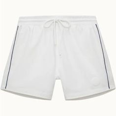 White Swim Shorts With Elastic Waist, Drawstring Tie And Piping On Side. Short Leg Length, Features A Mesh Inlay, Side Seam Pockets And Back Patch Pocket. Shorts Come With Matching Pouch. White Summer Bottoms With Elastic Side Panels, White Summer Swim Trunks, White Shorts For Spring Poolside, Summer Sports Bottoms With Elastic Side Panels, Summer Loungewear Bottoms With Elastic Side Panels, White Cotton Swimwear With Elastic Waistband, Summer Athleisure Bottoms With Elastic Side Panels, Sporty White Bottoms For Poolside, White Cotton Summer Swim Trunks