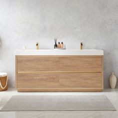 a bathroom with a sink, mirror and rug