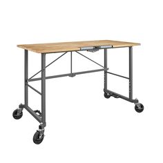 Take the SmartFold portable work desk anywhere the work is. When your work is done, simply fold and store away. Made with industrial-strength steel, this utility table has a weight capacity of 400 pounds on the Hardwood top shelf. The two locking casters allow you to keep it in place while you work. Folds in seconds, saving you time and storage space. With plenty of leg room under the desk top and a large working surface, this versatile work desk is ready to handle any DIY project. Cosco Rolling Grey with Hardwood Top Hardwood Portable Work Bench | 66760DKG1E Workbench On Wheels, Workshop Bench, Dark Grey Rooms, Portable Workbench, Folding Workbench, Grey Desk, Craft Desk, Grey Room, Work Desk