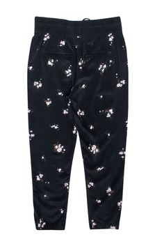 Embrace both comfort and style with A.L.C.'s "Aster" silk pants. Crafted from luxe silk, these soft pants feature a dainty light pink floral print, contrasted by their solid black drawstring waistband for a cozy-cute look. A loosely tailored leg achieves the perfect blend of casual and elegant, making these silky pants a versatile must-have. Size 8 100% Silk Slip-on Elastic waistband w/ drawstring Loosely tapered leg Waist 31.5" Inseam 27.5" Length 40.5" Spring Silk Lounge Pants, Spring Silk Loungewear Pants, Silk Loungewear Pants For Spring, Casual Silk Bottoms For Workwear, Casual Silk Pants With Elastic Waistband, Casual Silk Bottoms With Relaxed Fit, Casual Silk Bottoms For Spring, Casual High-waisted Silk Pants, Casual Silk High-waisted Pants