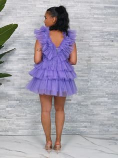 Our Center of Attention Tulle Tiered Mini Dress featuring Allover Tulle, Tiered Skirt and Shoulders. Back Zipper Closure. Mini Length. Lined. Tulle Dress Short Purple, Purple Tiered Mini Dress With Ruffles, Purple Tulle Dress, Lilac Tulle Mini Dress, Luxury Purple Ruffled Mini Dress, Tulle Short Dress, Playful Purple Tulle Tutu Dress, Tulle Mini Dress, Semi Formal Dresses