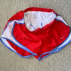 Nike Running Shorts Size S Red And Carolina Blue With White Panels Never Worn Nike Red Bottoms For Spring, Red Stretch Athletic Shorts For Spring, Red Workout Shorts For Spring, Red Athletic Shorts For Spring, Red Nike Workout Bottoms, Stretch Red Shorts With Pockets, Red Stretch Shorts With Pockets, Nike Red Bottoms With Built-in Shorts, Red Stretch Nike Athletic Shorts