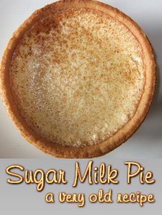 a sugar milk pie on a table with the words sugar milk pie written below it