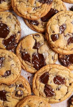 chocolate chip cookies are piled on top of each other