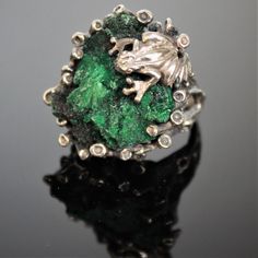 The ring of Melant is made manually of 925 sterling silver and natural plaid malachite. The ring is manually assembled directly on the stone. Each ring is individual and unique. The texture of plisse malachite resembles the interweaving of overgrown branches of a shrub, and the luster of the polished surface is akin to the dull flicker of twisted silk. Such a stone can be used in contrast with turquoise malachite - mainly as a low-expressive background. Malachite is a stone that perfectly combin Unique Sterling Silver Emerald Ring For May Birthstone, Unique Sterling Silver Green Emerald Ring, Unique Green Tsavorite Ring, Green Sterling Silver Nature-inspired Ring, Unique Silver Malachite Jewelry, Unique Collectible Sterling Silver Emerald Ring, Hand Cast Green Jewelry Gift, Hand Cast Green Jewelry For Gift, Unique Sterling Silver Emerald Ring Collectible