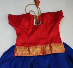 Baby girl traditonal grand silk skirt and top -blue and red top - pure silk fabric with pure zari . Cotton inner lining . This dress is idle when you are going to dress up your angel with nice traditonal jewellery . This gives a traditional look to your angel when she wears it to the wedding/festivals/functions/pooja/party/get together or any social occasions.  She feels comfortable wearing this dress as it has a cotton lining for both top and skirt . Its a light weight soft kanchipuram  silk . Blue Skirt Set For Festivals, Blue Tilla Sets For Diwali, Blue Skirt Set For Festive Navratri, Traditional Blue Skirt Set For Festivals, Blue Skirt Set For Diwali Festival, Festive Blue Skirt Set For Diwali, Red Traditional Drape Dress For Puja, Blue Anarkali Skirt Set For Festive Occasions, Traditional Blue Festive Skirt Set