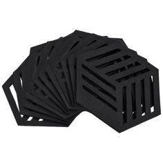 six black foam coasters sitting on top of each other