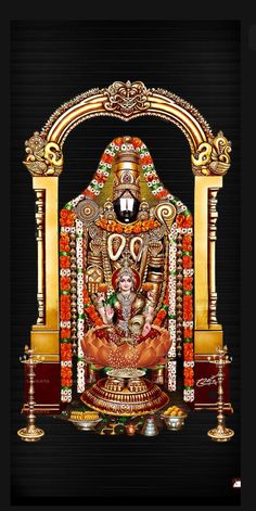 an idol is displayed in front of a black background with red and gold trimmings