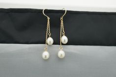 This is the perfect option for those who like cool, unique jewelry and the luxury, shine of gold, white. These earrings are well made, cute and/or elegant in design, and very desirable. The earrings are decorated with natural pearls. The earrings are piercing. The clasps are in good working condition. ♥ Age/Era: Circa before the 2003s. ♥ The earrings have a hallmark. It is 14K.585 ♥ The earrings are about 2'' long. The weight is about 2.3gr. Everyone interested in the jewelry should remember tha White 14k Gold Dangle Jewelry, White 14k Gold Drop Jewelry, White 14k Gold Pearl Drop Earrings, White Gold 14k Gold Dangle Pearl Earrings, Hypoallergenic White Gold 14k Pearl Earrings, Hypoallergenic 14k White Gold Pearl Earrings, 14k Gold Dangle Pearl Earrings For Anniversary, 14k Gold White Pearl Pierced Earrings, 14k Gold White Hypoallergenic Earrings