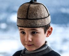 "Cute Georgian Kids hat, \"Svan\" cap of Natural 100% wool. The Svan cap has a round shape. Wear it at any time of the year: in winter, dense wool protects from frost, and in the summer months from the scorching sun, and also a cute cap is suitable for both mens and womens Svaneti is a historic region in Northwest Georgia. Cap is a very necessary thing in the harsh mountain climate. Wearing a cap helps to relieve headaches and tension. This cap has an ancient origin.Svan cap was expensive gift , Handmade Winter Costume Cap, Winter Wool Hat As Gift, Flat Cap Hats As Winter Gifts, Handmade Wool Hats For Outdoor, Handmade Felt Hat For Winter, Handmade Felt Cap For Winter, Handmade Felt Hat For Winter Gift, Gray Hat, Personalised Gifts Handmade