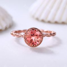 Art Deco 7mm Round Cut Padparadscha Sapphire Ring,Marquise Shaped Plain Gold Band,Rose Gold Plated Ring,Anniversary Birthday Ring For Women Main Ring Metal Type: Rose Gold ( Rose/Yellow/White Gold, Platinum, Silver Only, Rose/White/Yellow Gold Plated is available ) Center Stone: 7mm Round Cut Lab-created Padparadscha Sapphire Engagement Ring Side stone: Plain Gold Band  Prongs pave set ★Size: US3-10 (If your ring size is lower than 3 or larger than 10,please contact me firstly. I will custom make this ring size for you.) ★Craft Period: All our items are handmade, pls allow me 2-3weeks to finish. Rush finish and rush delivery service are also available if you pay extra fee. When you need it, pls email me directly. Rush finishing listing: www.etsy.com/listing/465555469/extra-cost-for-rush-or Pink Topaz Ring Gift, Rose Gold Ring With Round Stone For Anniversary, Rose Gold Round Topaz Birthstone Ring, Pink Round Birthstone Ring With Bezel Setting, Rose Gold Topaz Ring With Birthstone, Pink Birthstone Ring With Bezel Setting, Rose Gold Topaz Ring With Prong Setting, Rose Gold Topaz Ring With Center Stone, Rose Gold Birthstone Ring With Accent Stones