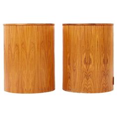 two wooden vases sitting side by side on a white background, one is empty