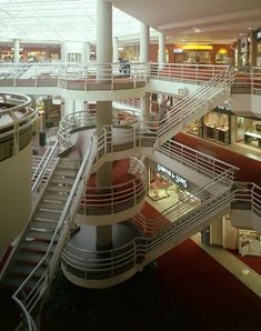 the inside of a building with multiple floors and stairs