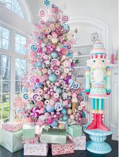 a brightly colored christmas tree with candy decorations