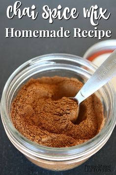 homemade spice mix in a glass jar with a spoon on the side and text overlay reading chai spice wfx homemade recipe