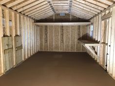 the inside of a storage room with wooden walls and flooring in place for insulation