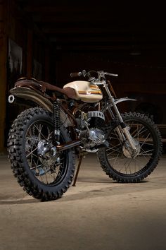 a dirt bike parked in front of a garage