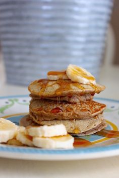 pancakes with bananas and syrup on a plate