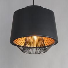 a black lamp hanging from the ceiling with a light bulb on it's side