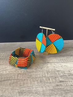 African Print Jewellery Set Sold as separates Features - Ankara Circle Earrings - Ankara Bangle Primary Colours: - Multi You can find out more about our brand at: https://www.naborhi.com You can follow us on: https://www.instagram.com/naborhi.africa/ https://facebook.com/naborhi Thank you for visiting our shop! Temisan If you have any questions about any of our items please give me  a shout Check out our shop for more African Inspired Fashion and Accessories: https://www.etsy.com/uk/shop/Naborhi Adjustable Round Multicolor Jewelry Sets, Adjustable Multicolor Jewelry Sets For Gifts, Ankara Jewelry, African Bangles, Ankara Earrings, Primary Colours, African Inspired Fashion, Printed Jewelry, Jewellery Set