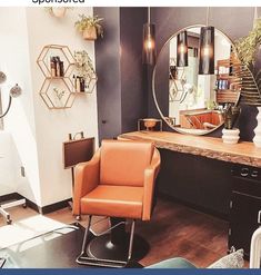 a chair and mirror in a room with mirrors on the wall above it that has plants