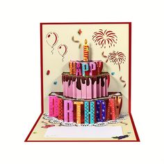 a birthday cake with candles and confetti on it is in front of a card