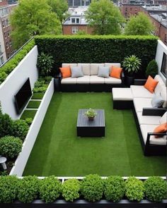 an outdoor living area with grass and couches