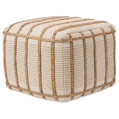 a white and brown striped ottoman with rope trimmings on it's sides