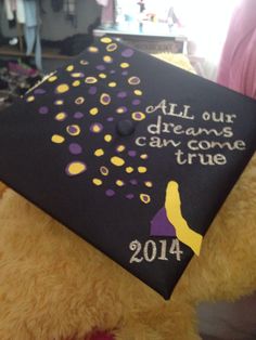 a graduation cap that says, all our dreams come true