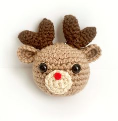 a crocheted reindeer head with big eyes