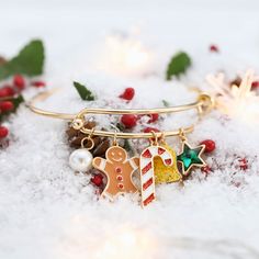 Get ready to spice up your holiday style with our Gingerbread Man Bracelet! This festive accessory is as cute as a freshly baked gingerbread cookie. With its charming gingerbread man charm and colorful accents, it's the perfect way to add a playful and delicious touch to your Christmas ensemble. Wear it with a wink and spread the holiday cheer!  DETAILS Plating: 18K Gold Materials: 18K Gold on Brass, Dripping oil,  Imitation Pearl, Zircon Maximum Diameter: 2.40 "(6.1cm) Weight:  15 g Cinderella Pumpkin, Christmas Gingerbread Men, Unique Gift Wrapping, Butterfly Gifts, Purple Grapes, Star Bracelet, Christmas Gifts For Women, Christmas Gingerbread, Gingerbread Man