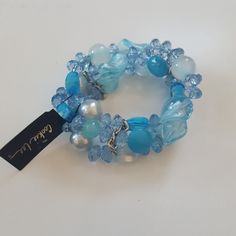 Blue Glass Bead Bracelet Casual Adjustable Blue Pearl Bracelet, Blue Wrap Bracelet With Colorful Beads, Casual Blue Bracelets With Large Beads, Trendy Blue Bracelets With Faceted Beads, Trendy Blue Beaded Bracelets For Party, Blue Crystal Bracelet With Large Adjustable Beads, Adjustable Blue Crystal Bracelet With Large Beads, Blue Beaded Crystal Bangle Bracelet, Blue Faceted Beads Bracelets For Beach