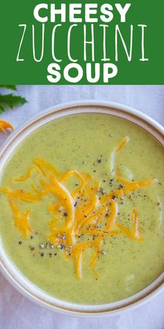 a bowl of cheesy zucchini soup on a white tablecloth with the title above it