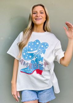 Step up your summer style in this playful Western boots graphic tee with 'America' sequin lettering embroidery. Perfect for Fourth of July festivities or just adding some fun and classic flair to your wardrobe. True to size Oversized fit intended Round neckline Pull on fit Sequin lettering embroidery Not lined 100% cotton Fabric has little stretch Lettering Embroidery, Floral Dress Casual, Black Short Dress, Dress With Cardigan, Dressy Casual, Casual Blouse, Floral Dress Black, Headband Hairstyles, Dress Romper