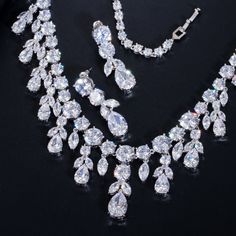 Experience the charm of the Cubic Zirconia Bridal Necklace in  elegant jewelry piece.

– This bridal shinning cubic zirconia gemstone necklace set is perfect for adding elegance to any bridal ensemble.
– Made with high-quality materials, this set includes a stunning necklace and matching earrings for a complete look.
– Perfect for pageant, bridal, bridesmaid, prom, quinceañera or special occasion Jewerly Set, Bridal Necklace Set, Crystal Jewelry Sets, Zirconia Necklace, Cubic Zirconia Necklace, Prom Jewelry, Cubic Zirconia Jewelry, Mobile Screen, Necklace And Earring Set