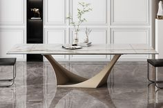 a marble dining table with two chairs and a vase on the end, in front of a white wall