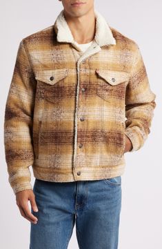 A cozier counterpart to the classic trucker jacket, this wool-enriched version is lined with plush high-pile fleece to add toasty warmth and softness. 25" length (size Medium) Front snap closure Spread collar Chest snap-flap patch pockets; front welt pockets Lined, with 100% polyester faux shearling 84% polyester, 16% wool Dry clean or machine wash, tumble dry Imported Trucker Jacket Men, Sherpa Trucker Jacket, Levis Jacket, Mens Plaid, Plaid Jacket, Trucker Jacket, Mens Outerwear, Gray Jacket, Welt Pockets