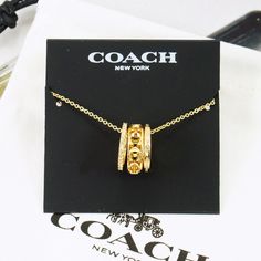 Nwot Coach Signature Metal Openwork Crystal Necklace I Will Not Accept The Offer For A Bundle Deal, The Bundle Deal Already Included A 15% Discount. Pendant Approx. 3/4" X 1/4" Length Approx. 16" + 2" Extension Gold Plated Brand New With A Pouch, No Gift Box. Great Gift, Early Shopping For Christmas!!! Please Check My Store For Other Colors And Styles!! Chic Coach Jewelry As Gift, Chic Coach Jewelry As A Gift, Elegant Coach Necklace For Gift, Coach Gold Jewelry For Anniversary, Gold Coach Jewelry For Anniversary, My 20 Birthday, Shopping For Christmas, Jewelry Stack, Candle Pedestal