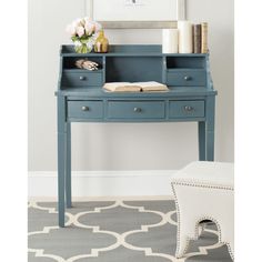 a blue desk with drawers and a white chair