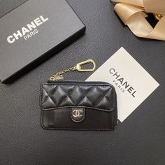 Luxurious Chanel Design: The wallet card holder features Chanel's signature elegance, showcasing the brand's iconic aesthetic. This timeless design adds a touch of sophistication and luxury to any ensemble. Premium Genuine Leather: Crafted from high-quality genuine leather, this wallet card holder provides a luxurious texture and exceptional durability. The leather construction ensures a long-lasting, stylish accessory. Secure Zipper Closure: The wallet is equipped with a secure zipper closure, ensuring that your cards and cash are safely stored. The zipper adds an extra layer of protection, preventing accidental loss of contents. Multiple Card Slots: Designed with multiple card slots, this wallet offers ample space for organizing your credit cards, IDs, and other essential items. The orga Iconic Aesthetic, Bling Phone Cases, Chanel Design, Zippers Fashion, Luxury Phone Case, Genuine Leather Wallets, Chanel Paris, Essential Items, Wallet Card