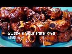 sweet and sour pork ribs on a blue plate with chinese characters in the background text reads sweet & sour pork ribs