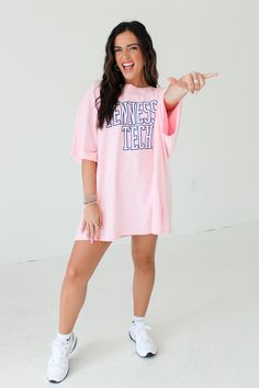 Tennessee Tech Oversized Graphic Tee in Pink DETAILS one size oversized fit Tennessee tech Collegiate Oversized Tops For Loungewear, Oversized Text Print Top For College, Oversized Text Print Top For Athleisure, Trendy Oversized Top For Game Day, Collegiate Style Relaxed Fit Spring Tops, Collegiate Style Relaxed Fit Tops For Spring, Spring Oversized Tops For College, Oversized Spring College Tops, Spring Collegiate Loungewear Tops