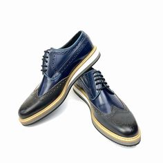 Scarpetto Navy Blue Wingtip Dress Shoes for men are presented in genuine leather. Its lace-up designs characterize the latest collections. With a wingtip and stchiting design, this dress shoe is defined by its unique style and quality. The shoe's refined material and lace-up detail mix with elements taken from the world to create a versatile piece that blends a casual look. Built with genuine leather offers a classy finish and superior stability. A polished genuine leather upper delivers a distinctive everyday look. You can buy this plain shoe for your individual style. You can pair them down to complete a smart formal look. Product Features  Genuine Leather, Fitted with EVA Sole Upper Material: Calf Leather Inner Material: Sheep Leather Sole Material: EVA Shoe Width: Medium(B,M) Heel Heig Blue Wingtip Dress Shoes With Brogue Detailing, Blue Wingtip Oxfords With Rubber Sole, Blue Wingtip Oxfords With Brogue Detailing, Blue Oxfords With Brogue Detailing, Blue Leather Cap Toe Shoes With Brogue Detailing, Navy Wingtip Oxfords With Leather Sole, Blue Wingtip Dress Shoes With Rubber Sole, Blue Lace-up Oxfords For Derby, Blue Lace-up Oxfords For Business