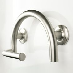 an image of a modern stainless steel sink faucet with handles and knobs